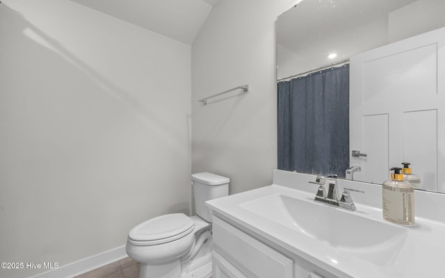 bathroom with vanity, a shower with shower curtain, toilet, and tile patterned flooring