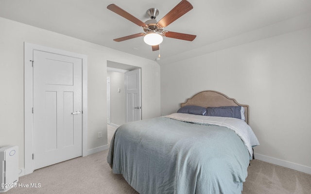 carpeted bedroom featuring ceiling fan