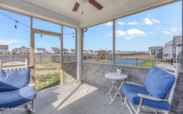 sunroom / solarium with ceiling fan