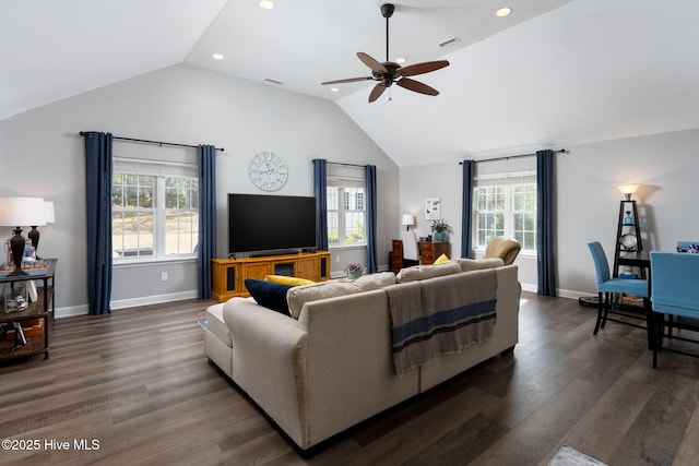 living room with dark hardwood / wood-style flooring, ceiling fan, plenty of natural light, and lofted ceiling