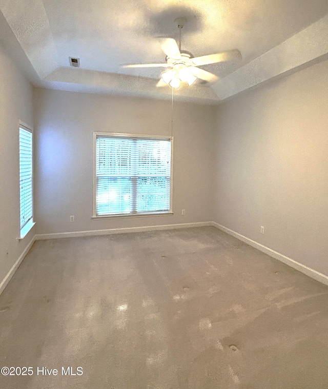 6237 Sentry Oaks Dr, Wilmington, NC 28409 - carpeted spare room with a raised ceiling, a ceiling fan, and baseboards