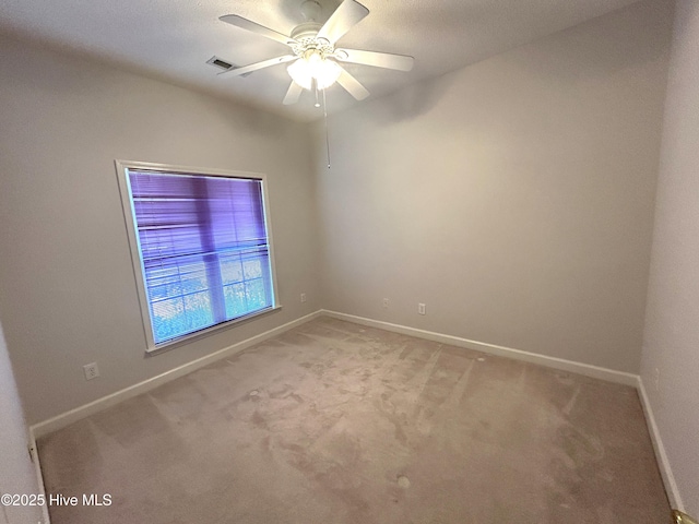 6237 Sentry Oaks Dr, Wilmington, NC 28409 - spare room with baseboards, light colored carpet, and ceiling fan