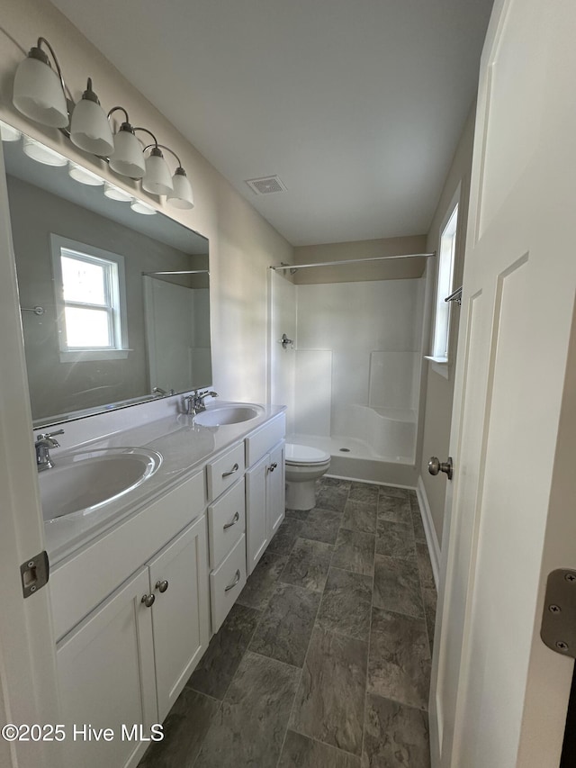 159 Montague Rd, Currie, NC 28435 - full bathroom featuring a shower, double vanity, and stone finish flooring