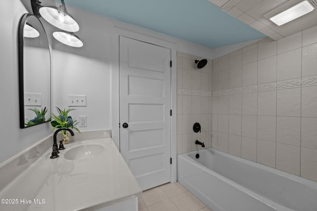 bathroom featuring tile patterned flooring, bathing tub / shower combination, and vanity