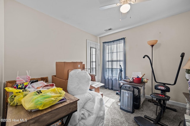 carpeted bedroom featuring baseboards, visible vents, and ceiling fan