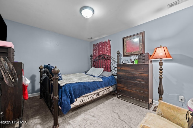 bedroom featuring carpet, visible vents, and baseboards