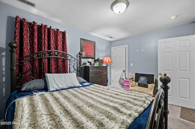 bedroom with light carpet and visible vents