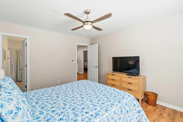 bedroom featuring wood finished floors, a ceiling fan, and baseboards