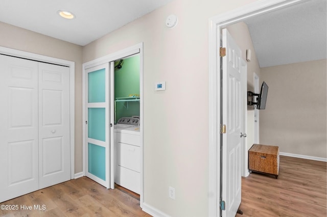 hall featuring washer / clothes dryer, recessed lighting, wood finished floors, and baseboards