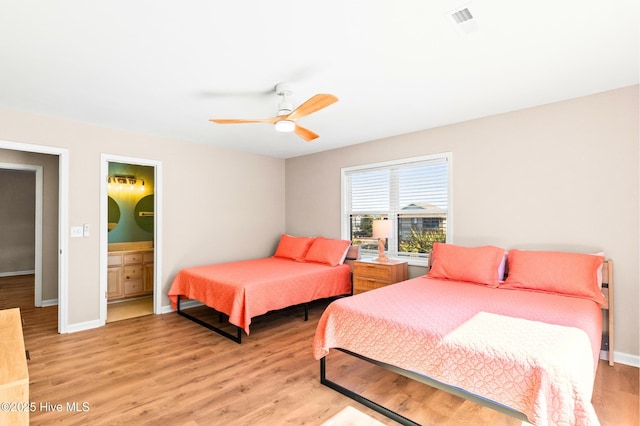 bedroom featuring visible vents, baseboards, connected bathroom, light wood-style flooring, and ceiling fan