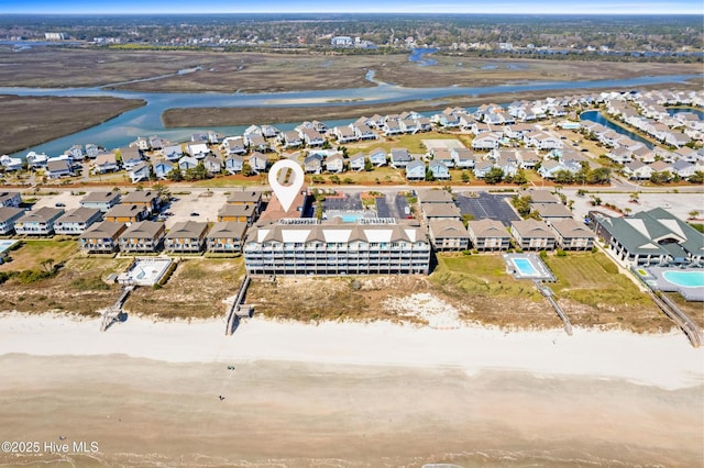 drone / aerial view with a residential view and a water view