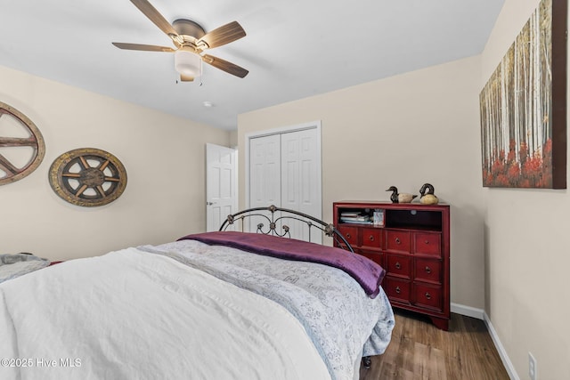 bedroom featuring a ceiling fan, a closet, dark wood finished floors, and baseboards