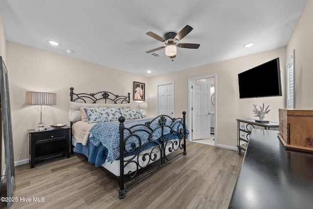 bedroom with a ceiling fan, recessed lighting, baseboards, and wood finished floors