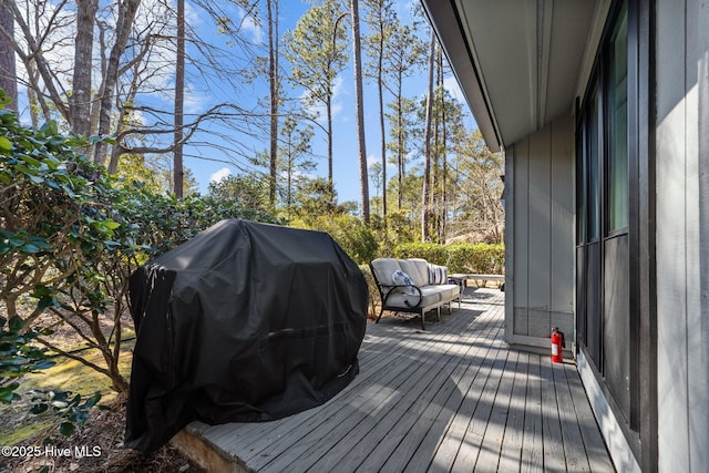 wooden deck with area for grilling