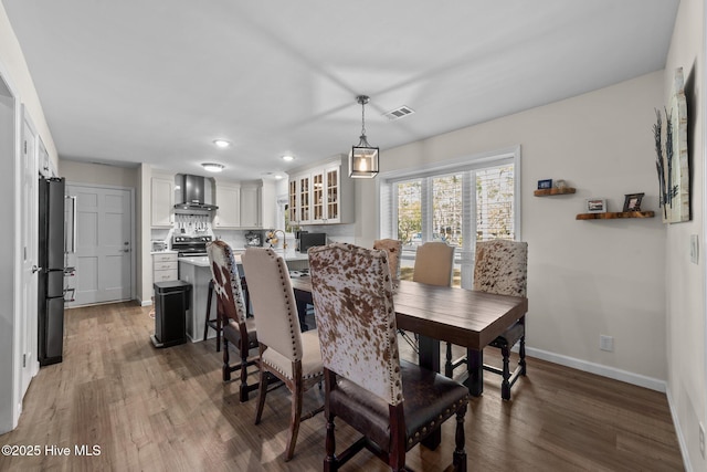 dining area with recessed lighting, visible vents, dark wood finished floors, and baseboards