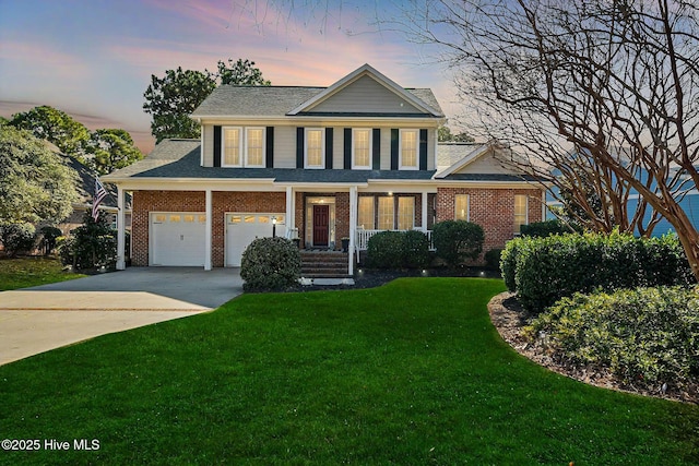 view of front of house featuring a garage and a lawn