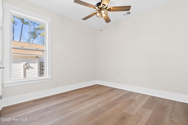 unfurnished room featuring light wood-type flooring and ceiling fan