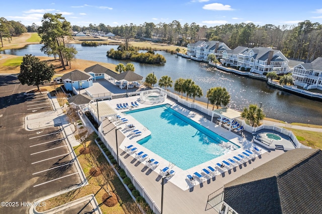 exterior space featuring a water view and a patio area