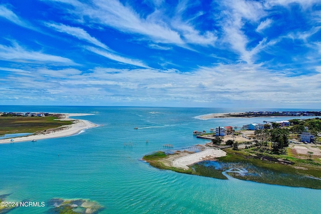 bird's eye view featuring a water view and a beach view