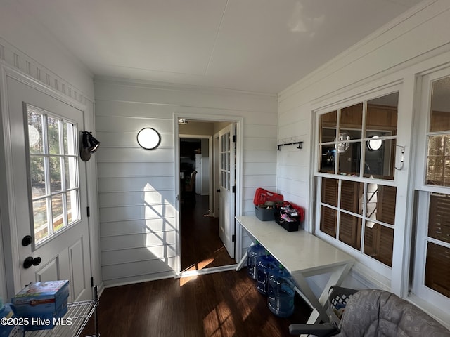 mudroom featuring a sunroom, crown molding, and wood finished floors