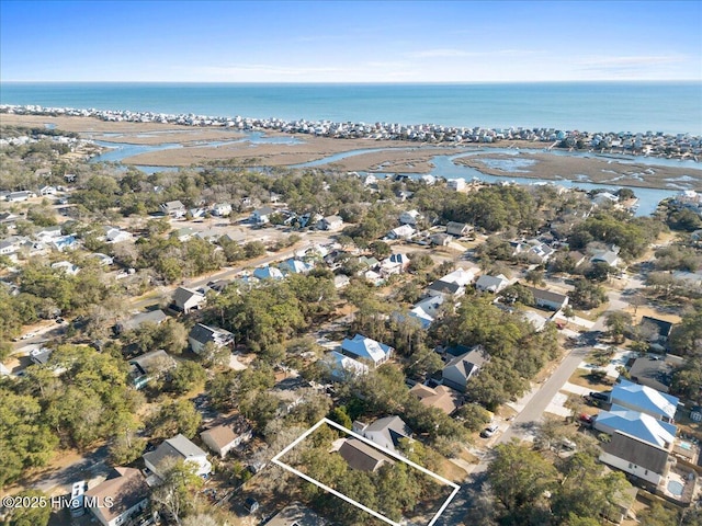 drone / aerial view featuring a residential view and a water view