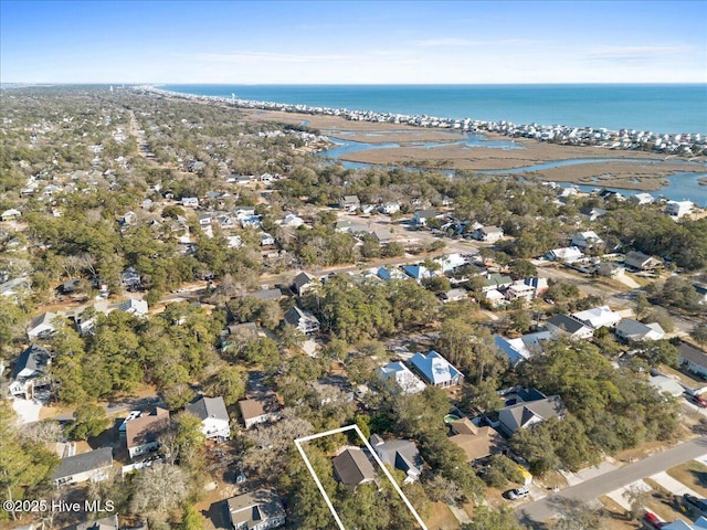 drone / aerial view with a residential view and a water view