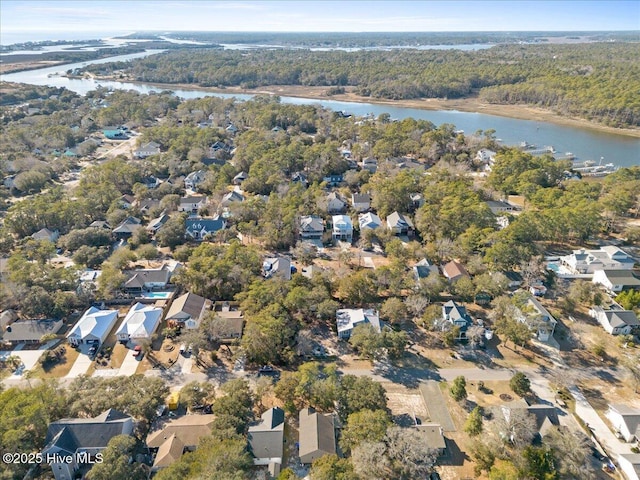 bird's eye view featuring a water view, a residential view, and a view of trees