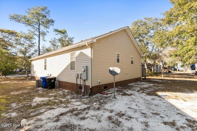 view of side of home with crawl space