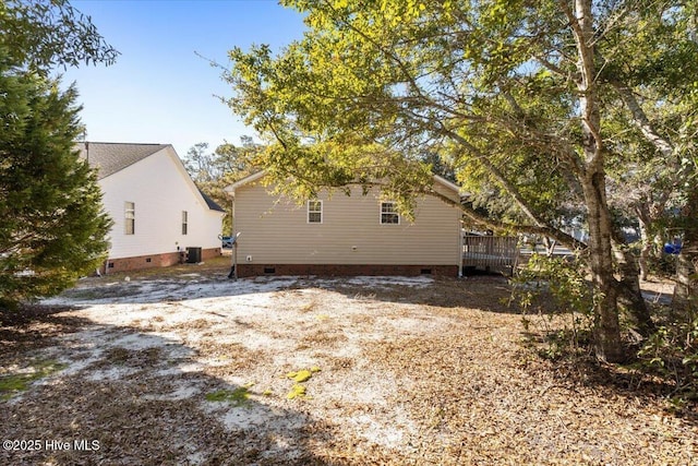 exterior space with crawl space and central AC