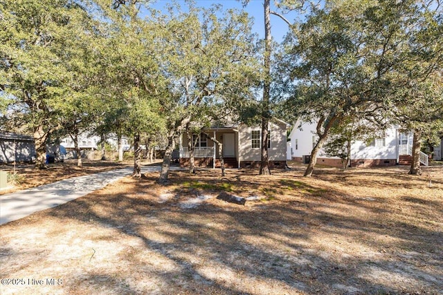 view of front of home with crawl space and a porch