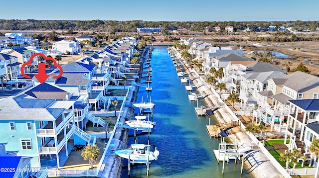 birds eye view of property featuring a water view and a residential view