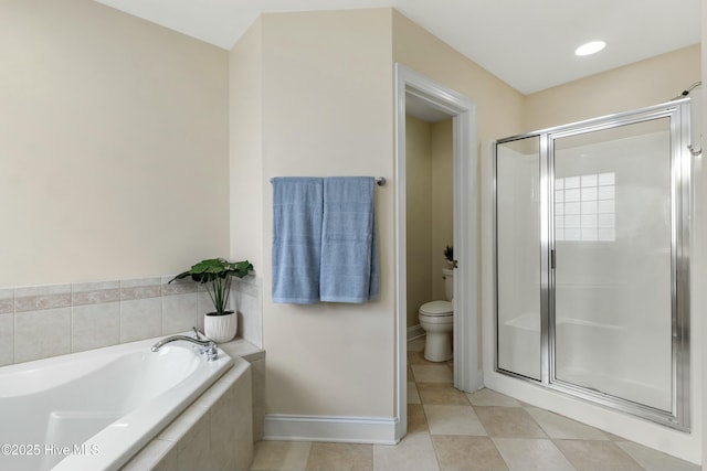 bathroom featuring tile patterned flooring, a shower stall, toilet, and a bath