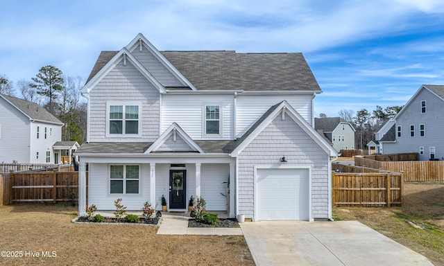 view of front of house with a front yard and a garage