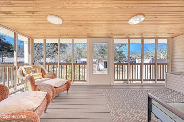 sunroom featuring wooden ceiling