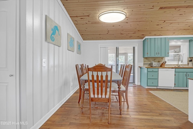 dining room with wood ceiling and light wood-style floors