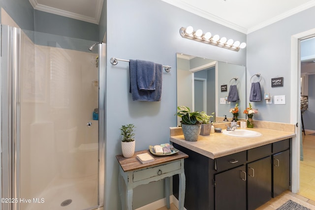 full bathroom featuring a shower stall, vanity, and crown molding