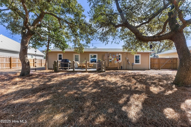 back of property with a fenced backyard