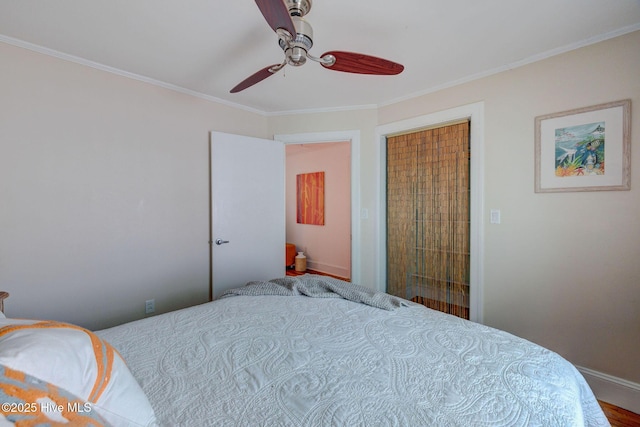 bedroom with baseboards, a ceiling fan, and crown molding