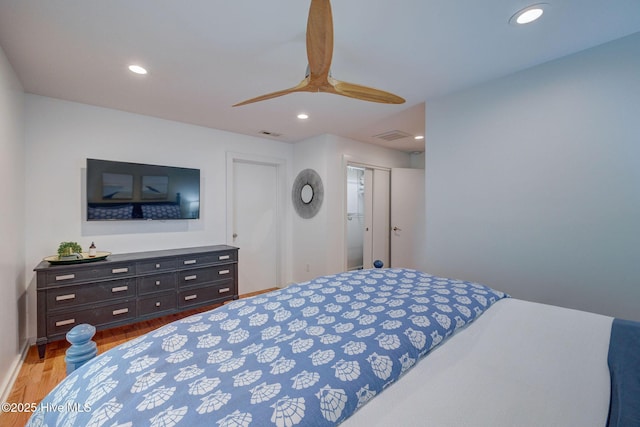 bedroom featuring a ceiling fan, light wood-type flooring, and recessed lighting