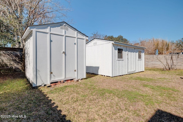 view of shed featuring fence