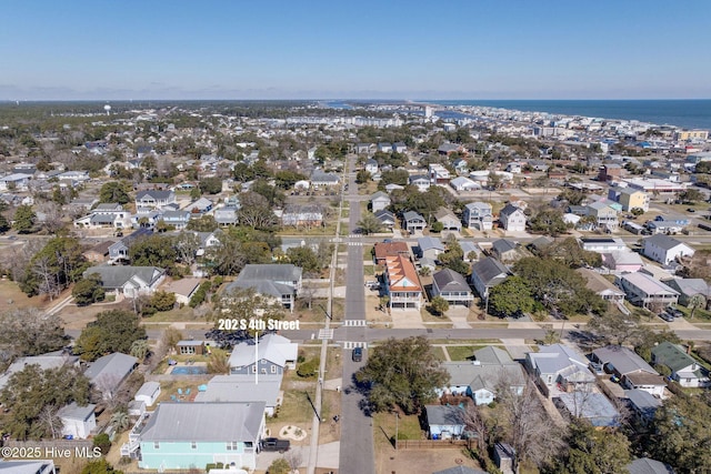 bird's eye view featuring a water view and a residential view