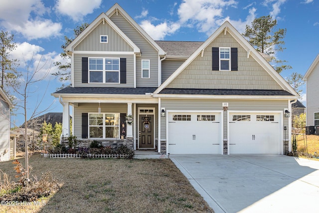 craftsman house with a garage and a porch