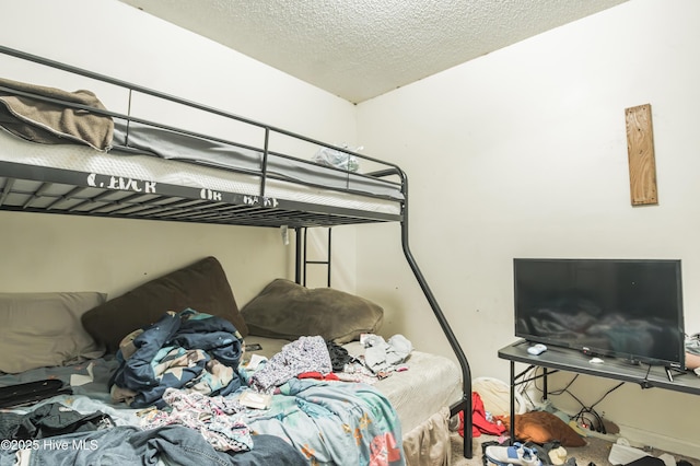 bedroom featuring a textured ceiling