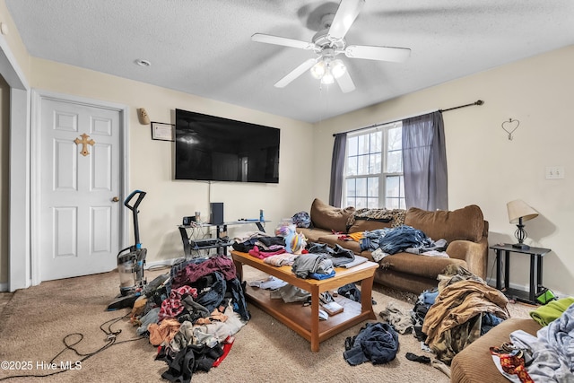 living room with carpet flooring, ceiling fan, and a textured ceiling