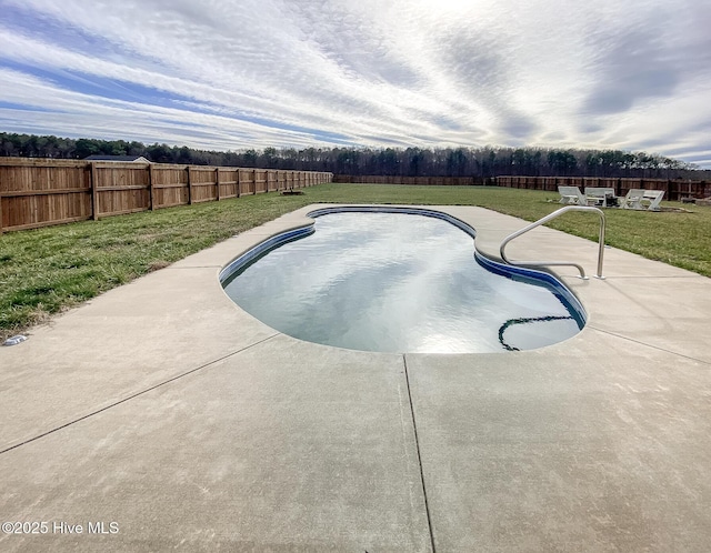 view of swimming pool with a yard, a patio, a fenced backyard, and a fenced in pool