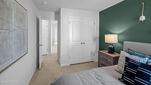 carpeted bedroom featuring a closet