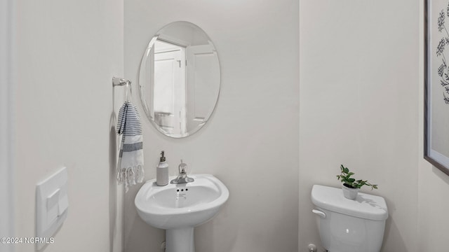 bathroom with sink and toilet