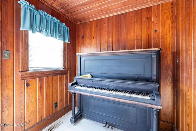 interior details featuring wood ceiling and wooden walls