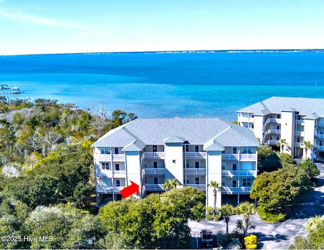 birds eye view of property with a water view