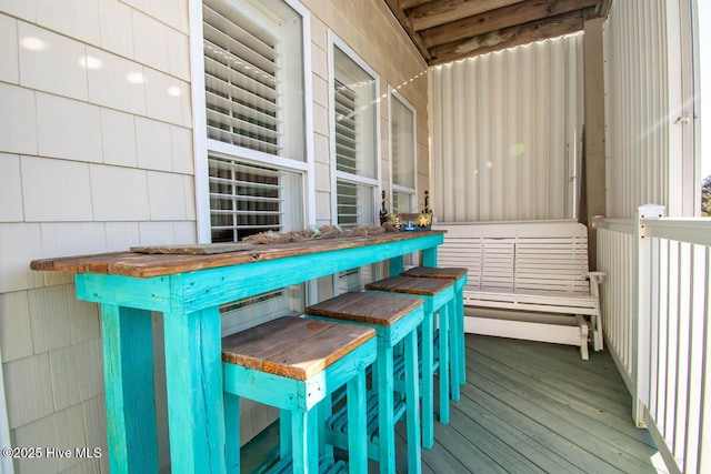 wooden terrace featuring outdoor dry bar